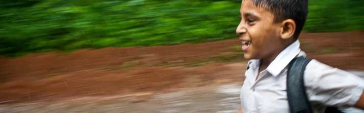Jahangirnagar-Dhaka-Bangladesh-School-Boy-Running-Rain.jpg-960x300